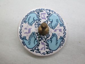 Hanukah Dreidel Ceramic Doves handmade. Hurwitz made this Hanuka Dreidel Sevivon Ceramic. He drew four blue flying doves on white back around dreidel.