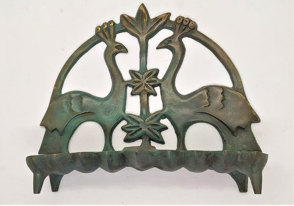 Handmade Menorah bronze two  peacocks with green patina spread over made by Shaul Baz. Can be either for candles or oil lighting.