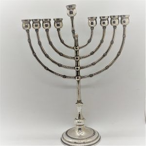 Handmade Menorah sterling silver branches with Yemenite filigree designs on branches and base of Menorah.Dimension 20.5 cm X8.5 cm X 24.5 cm.