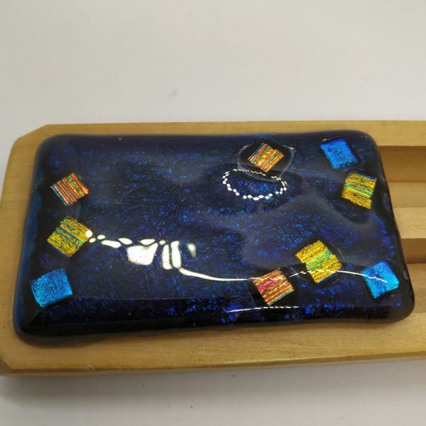 Purim Grogger fused glass and pine wood  handmade multi dark colors dark blue and gold. Dimension 16 cm X 5.7 cm X 2.4 cm approximately.