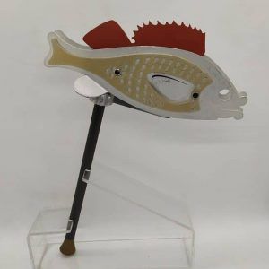 Purim Grogger Raashan Aluminum metal metal red grey & black colors a fish. It is a bit scratched. Dimension 17.7 cm X 2.2 cm X 8.5 cm approximately.