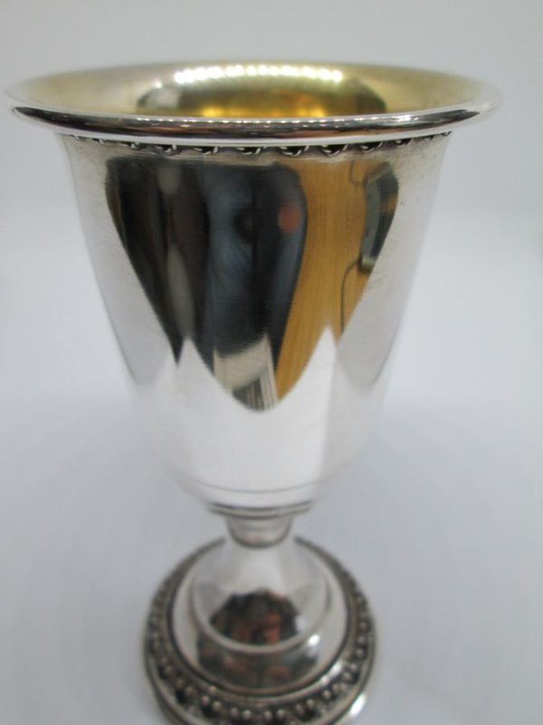 Sterling Silver Yemenite filigree Kiddush cup with filigree wires around borders. Dimension diameter 6.6 cm X 12.4 cm approximately.