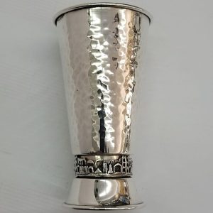 Sterling Silver Kiddush goblet Jerusalem design with hand hammered designs around & Jerusalem houses around borders diameter 6.6 cm X 12.3 cm approximately.