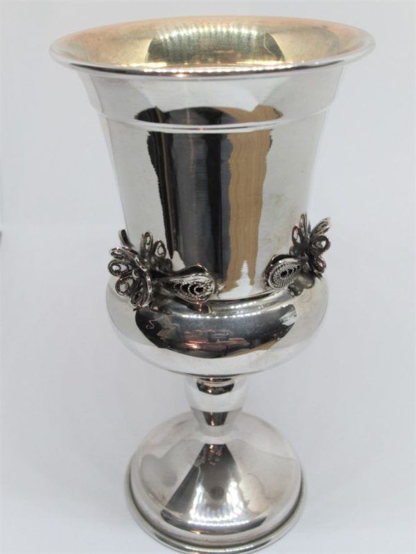 Handmade sterling silver filigree flowers Kiddush chalice with filigree flowers designs around. Dimension diameter 7.2 cm X 14 cm approximately