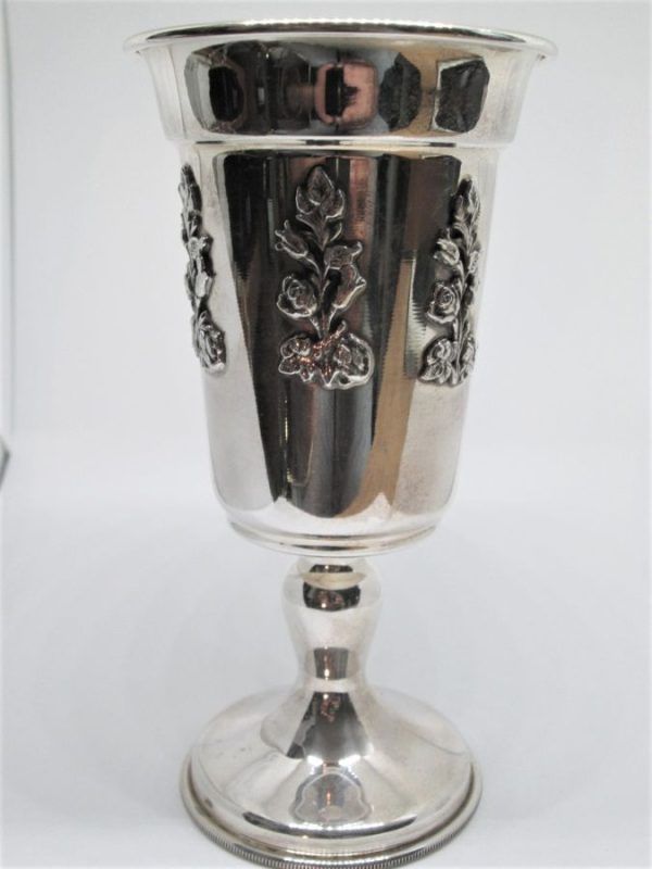 Sterling silver rose flowers Kiddush cup with rose flowers designs around .Dimension diameter 7.2 cm X 13.8 cm approximately.