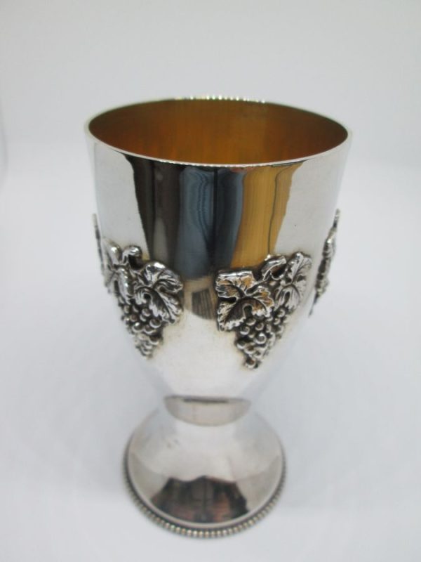 Sterling Silver Kiddush cup relief grapes with grapes designs around & silver pearl beads around border base. Dimension diameter 5.7 cm X 11.3 cm.