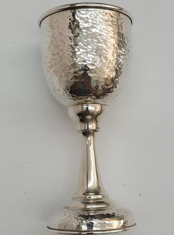 Silver Kiddush Cup Hammered handmade. Sterling silver Kiddush cup hammered contemporary design. Dimension diameter 8 cm X 16.3 cm approximately.