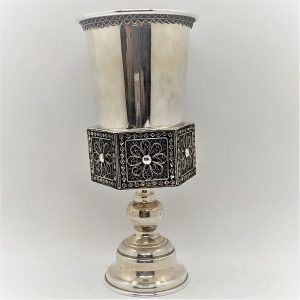 Silver Kiddush Cup Holder and cup. Sterling Silver Kiddush Cup Holder with Yemenite filigree design cup holder. Dimension diameter 7.2 cm X 15.2 cm.