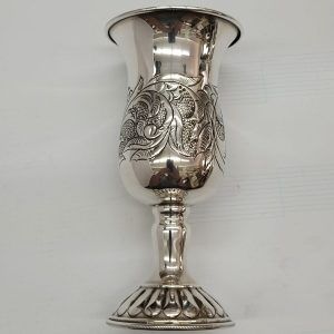 Sterling silver Kiddush cup foliage engravings with floral designs engravings around. Dimension diameter 6.8 cm X 14 cm approximately.