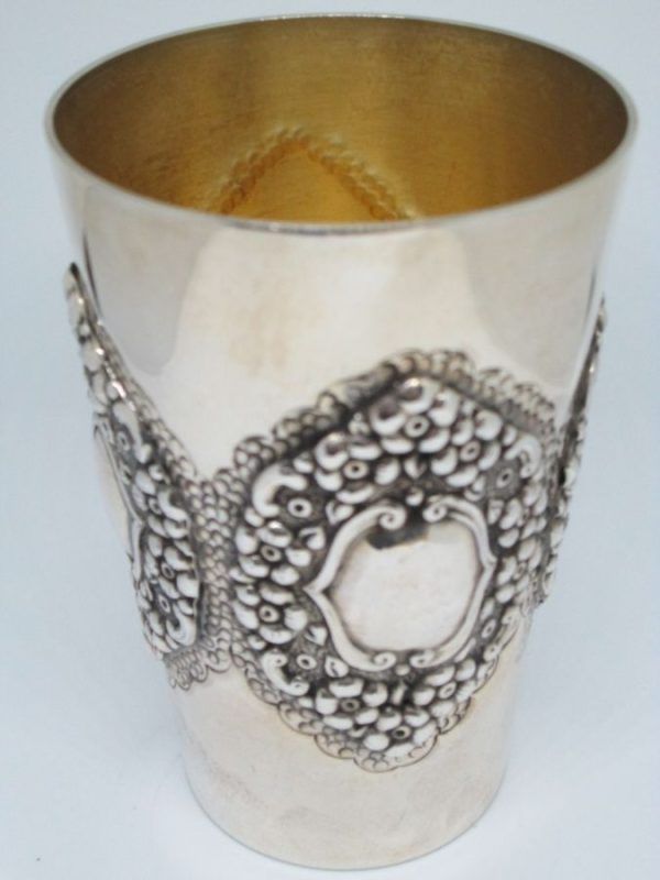Sterling Silver embossed flowers Kiddush cup with flowers designs around cup. Dimension diameter 6.5 cm X 9.8 cm approximately. 