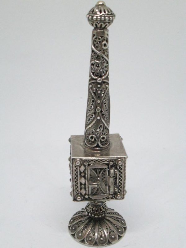 Handmade Yemenite filigree Havdalah box tower with silver Yemenite filigree designs around. Dimension 3 cm X 3 cm X 13 cm approximately.