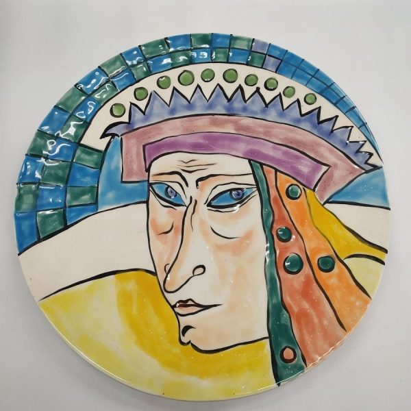 Ulshanski has designed in glazed ceramic round big dish a blue eyes queen with her crown. Dimension diameter 24 cm approximately.