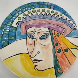 Ulshanski has designed in glazed ceramic round big dish a blue eyes queen with her crown. Dimension diameter 24 cm approximately.