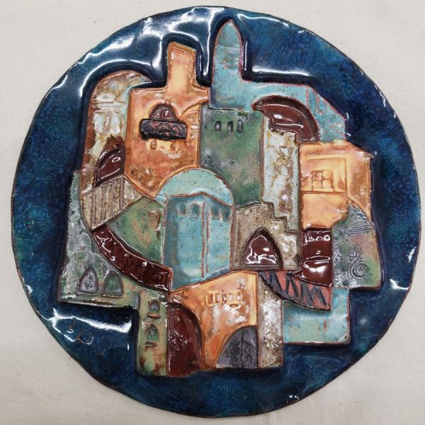 Handmade glazed ceramic Jerusalem houses round tile with different designs of Jerusalem housing and monuments. Dimension diameter 20 cm approximately.
