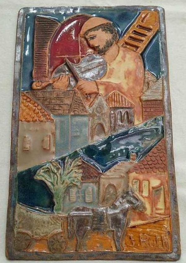 Handmade glazed ceramic tile Ruth Factor Fiddler Roof tile with a fiddler playing his violin on the roof 15.5 cm X 25.5 cm approximately.