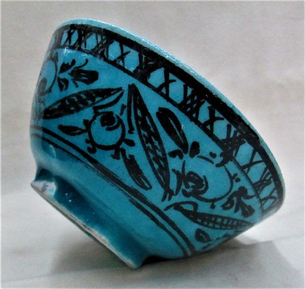 Glazed Ceramic Blue Bowl made of terracotta and blue Turquoise color with different fishes and floral designs.