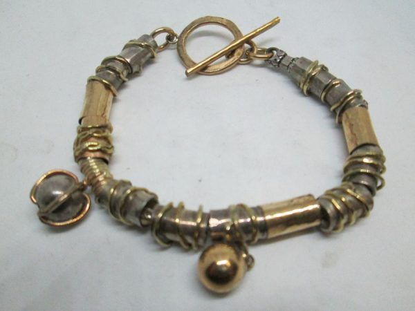 Handmade sterling silver gold bracelet ,14 carat gold bracelet contemporary style with silver designed cylinders.