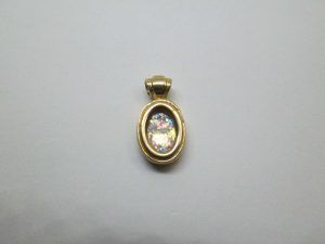 14 Carat Gold Pendant Roman Glass Oval. 14 carat gold oval pendant handmade set with ancient Roman glass. Dimension 0.9 cm X 1. 2 cm X 0.45 cm approximately.