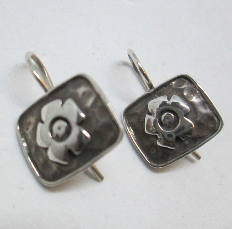 The hook in sterling silver earrings flower can be changed to screw finding for non pierced ears by request. Dimension 1.4 cm X 1.2 cm approximately.