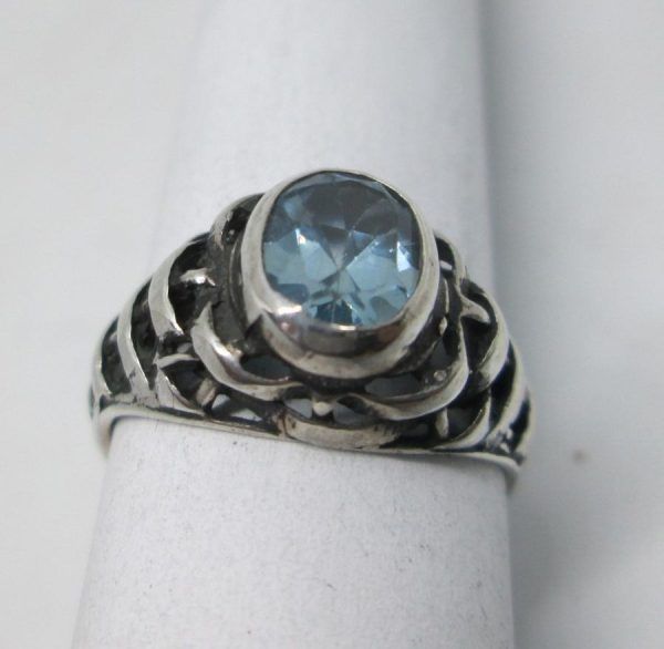 Handmade sterling silver blue Topaz ring contemporary style ring set with blue Topaz. Dimension 0.75 cm X 1.1 cm ring size 55.