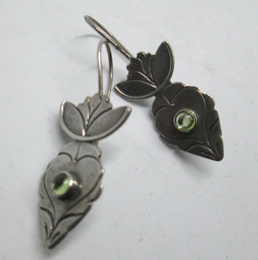 The hook in sterling silver earrings green peridot stones can be changed to screw finding for non pierced ears by request 1.5 cm X 2.8 cm approximately.