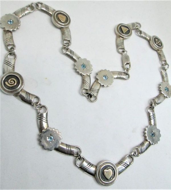 Handmade sterling silver & 14 carat gold choker necklace contemporary set with blue Topaz stones. Dimension 1.4 cm choker length 45 cm approximately.