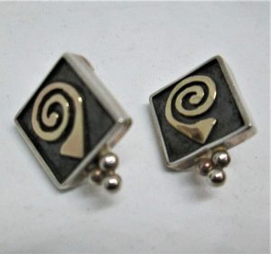 Sterling silver earrings gold snail 14 carat gold design, can not be altered to non pierced ear lobes.  Dimension 1.6 cm X 2.2 cm approximately.