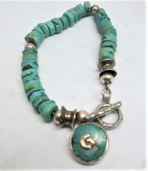 Sterling silver bracelet Turquoises silver beads, with semi precious Turquoises stone disks diameter 0.85 cm X 20 cm approximately.
