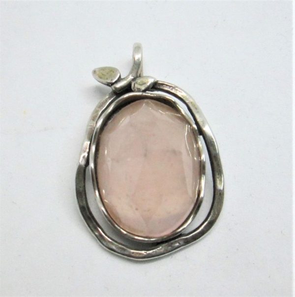 Handmade sterling silver pendant pear shape Rosequartz stone set in . Dimension 2 cm X 2.6 cm X 0.95 approximately.