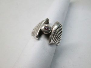 Handmade sterling silver contemporary style two wings silver ring set with Ruby stone. Dimension 1.4 cm ring size 52.