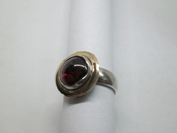 Handmade sterling silver round Garnet ring & 14 carat gold contemporary style ring set with cabochon Garnet stone.