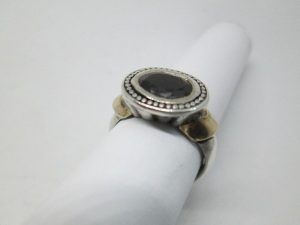 Handmade sterling silver & 14 carat gold contemporary style faceted Garnet stone ring. Dimension 1.2 cm X 1.9 cm ring size 54.