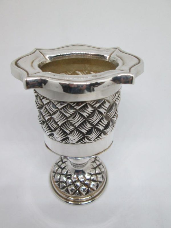 Handmade sterling silver Havdalah candle holder knot designs around candle holder. Dimension 6.7 cm X 4.6 cm X 10.4 cm approximately.