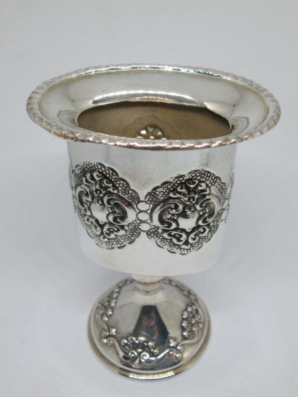 Handmade sterling silver Havdalah candle holder embossed around candle holder. Dimension 6.8 cm X 4.9 cm X 10.4 cm approximately.