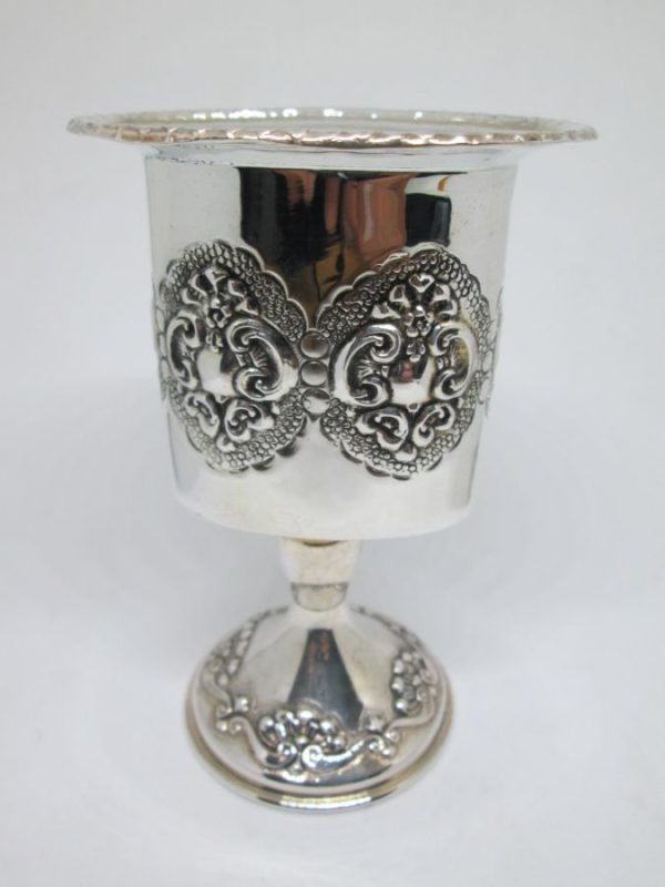 Handmade sterling silver Havdalah candle holder embossed around candle holder. Dimension 6.8 cm X 4.9 cm X 10.4 cm approximately.