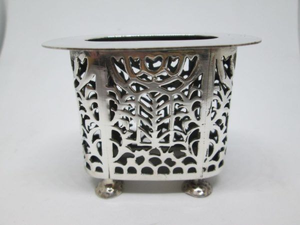 Handmade sterling silver Havdalah candle holder cutout designs with cut out Menorahs on both sides of candle holder.