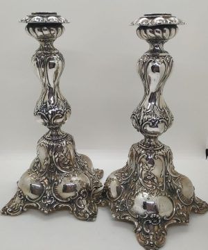 Sterling Silver European Sabbath Candlesticks handmade with embossed designs European style made in Israel. It is filled inside plaster. 