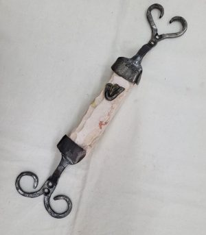 Contemporary carved Mezuzah Jerusalem smooth stone with caste iron frame by B. Dov. Dimension 4.0 cm X 3.8 cm X 38 cm approximately.