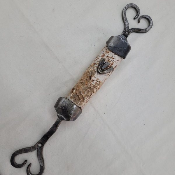 Contemporary Mezuzah raw Jerusalem stone carved stone with caste iron frame by B. Dov. Dimension 4.0 cm X 3.8 cm X 38cm approximately.