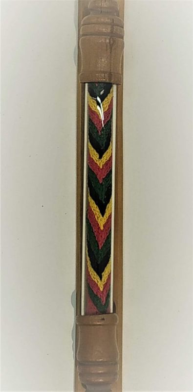 Mezuzah Wood Ethiopian Embroidery Green.Handmade natural wood Mezuzah with hand made Ethiopian Jews embroidery. Dimension 2.2 X 2.2 cm X 22 cm.