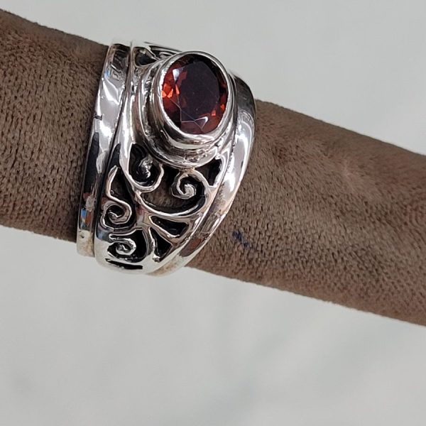 Handmade sterling silver cut out ring silver contemporary style ring set with faceted Garnet stone . Dimension 1.4 cm ring size 56.