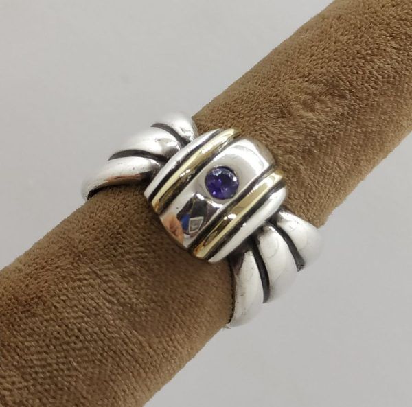 Handmade sterling silver & 14 carat gold contemporary style Amethyst gold silver ring set with Amethyst stone and tie ring shape.