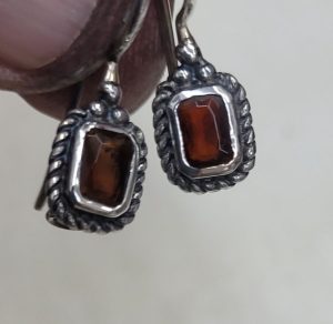 The hook in sterling silver earrings two Garnets stones can not be changed to screw finding for non pierced ears. Dimension 1.35 cm X 1.5 cm approximately.