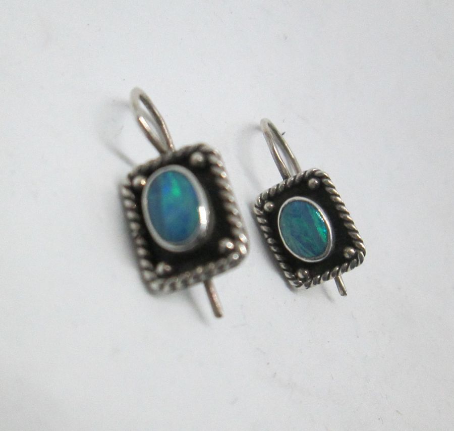 The hook in sterling silver oval Opal stone earrings can not be changed to screw finding for non pierced ears. Dimension 0.9 cm X 1.2 cm cm approximately.