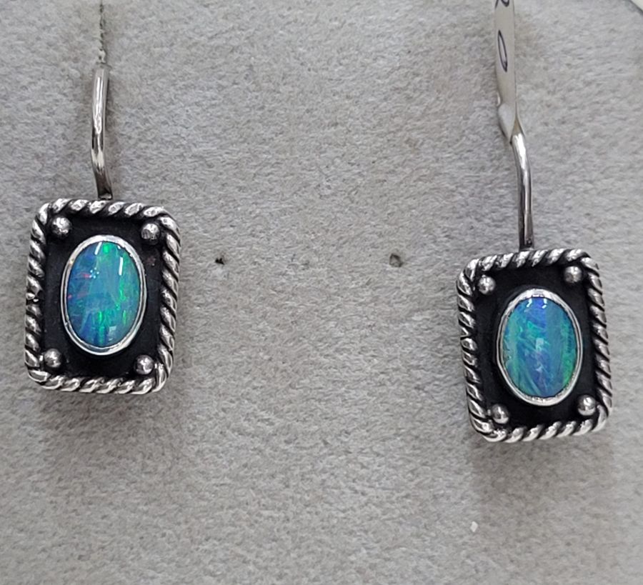 The hook in sterling silver oval Opal stone earrings can not be changed to screw finding for non pierced ears. Dimension 0.9 cm X 1.2 cm cm approximately.