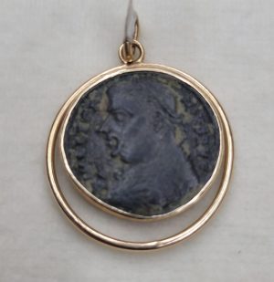 14 Carat gold antique Roman coin pendant with round wire around shape set with ancient genuine bronze Roman coin 3rd century AD.