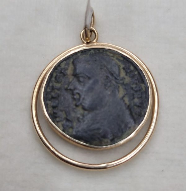 14 Carat gold antique Roman coin pendant with round wire around shape set with ancient genuine bronze Roman coin 3rd century AD.
