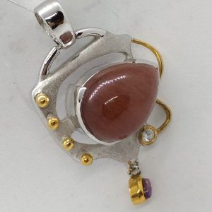 Handmade sterling silver and gold contemporary Carnelian Amethyst pendant set with brown cabochon Carnelian stone and Amethyst.