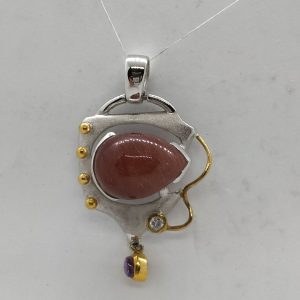 Handmade sterling silver and gold contemporary Carnelian Amethyst pendant set with brown cabochon Carnelian stone and Amethyst.