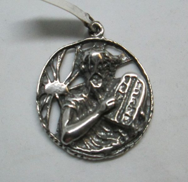 Handmade sterling silver Moses holding commandments pendant with the 10 Commandments in a round disk. Dimension diameter 2.7 cm X 0.5 cm approximately.